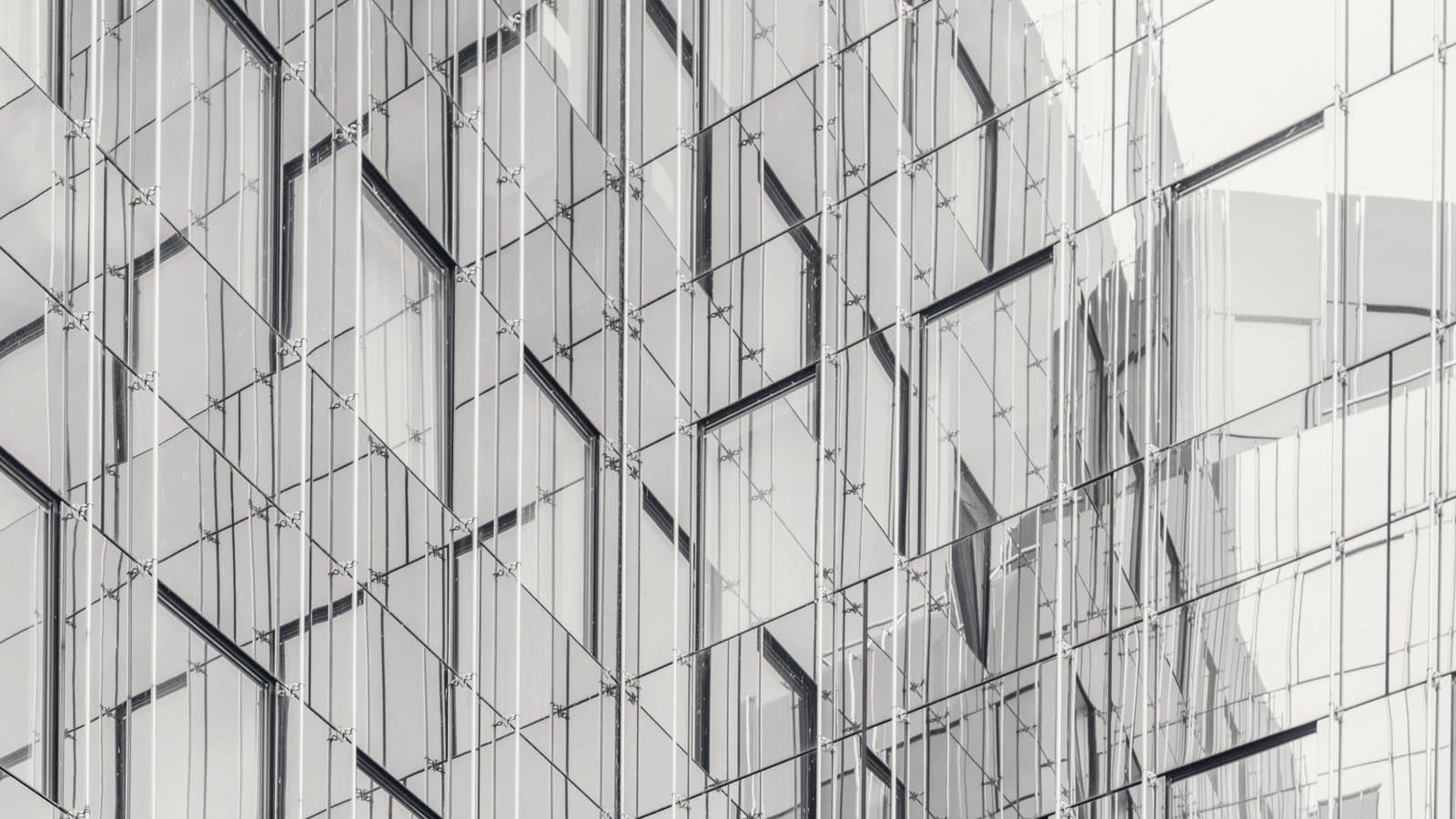 A glass facade lattice, one grid holding many panes.