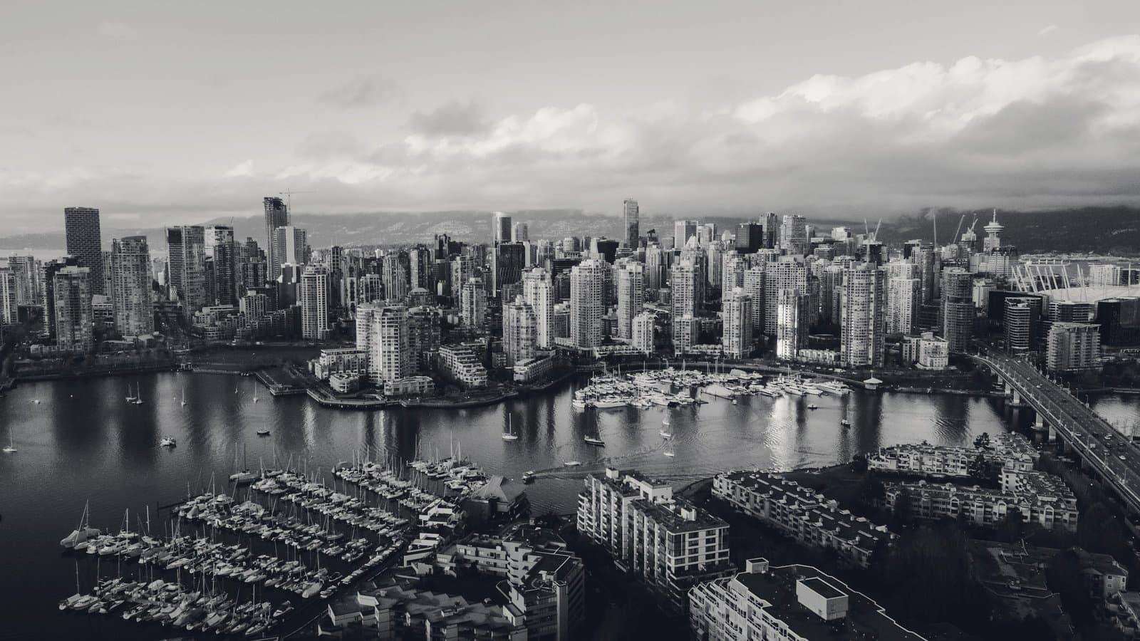 A marina and dense city seen from above.