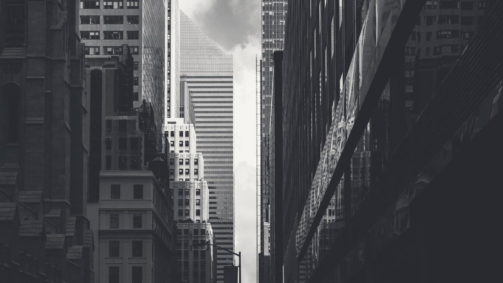 A midtown street canyon receding between towers.